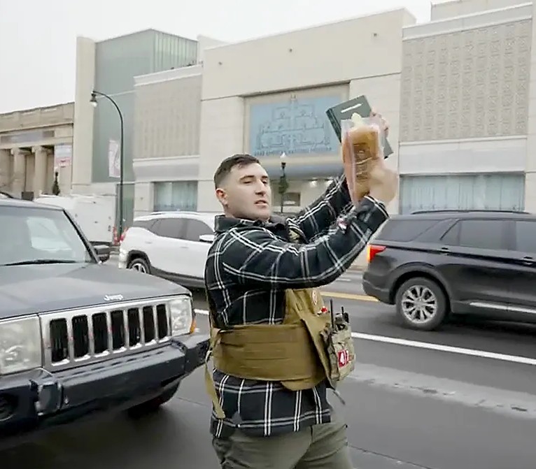 Jake Lang Slapping Bacon Against the Quran