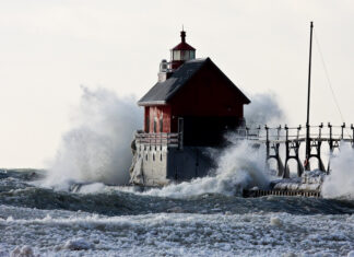 Who Defends the Great Lakes? Who Defends the Great Lakes? Image of waves crashing against Lighthouse in Lake Michigan.